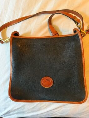 Dooney & Bourke navy Pebbled Leather Messenger with Brown Trim